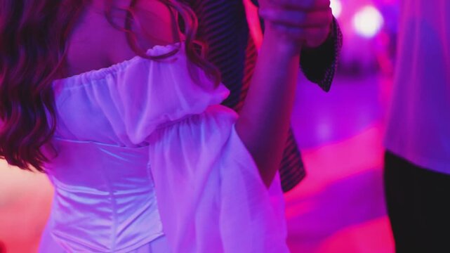 High school graduates dancing on prom, waltz and classical ball dance in dresses and suits on school graduation party, girls and boys classical ballroom dancers, couples dance quadrille and polonaise