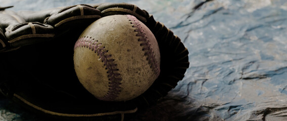 Old used baseball equipment on banner background with copy space for sport.