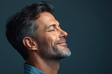 Fototapeta premium A close up of a man's face with her eyes closed