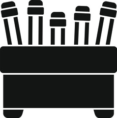 Black and white icon of markers standing in a container, ready for creative drawing and sketching