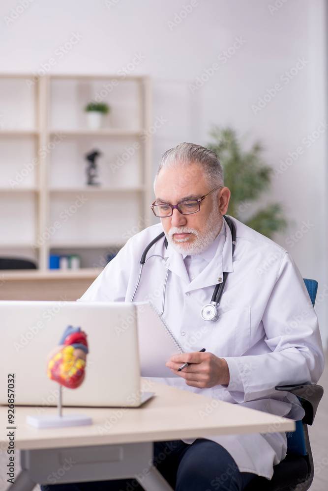 Wall mural old male doctor in telemedicine concept