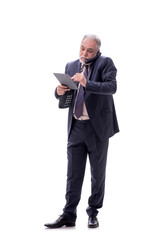 Old businessman talking by phone isolated on white