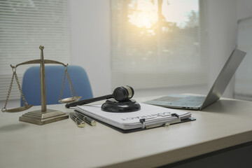 Lawyer desk displays key legal objects, scales of justice, a gavel, and a paper contract. No people are present, but the scene suggests ongoing legal services and visa processing.