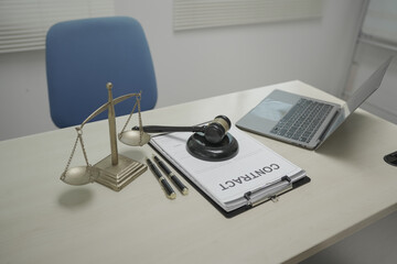 Lawyer desk displays key legal objects, scales of justice, a gavel, and a paper contract. No people are present, but the scene suggests ongoing legal services and visa processing.