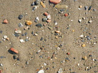 Background of river stone and sand on the beach seashore