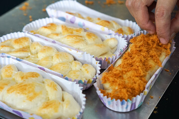 Variety of breads and buns on a cooling rack