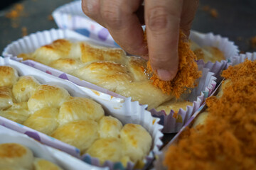 The making of chicken floss bun or bread. Close up.
