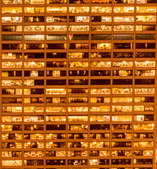 Office windows illuminated at night