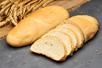 Freshly baked white bread loaf, sliced and ready to serve, perfect for sandwiches and breakfast