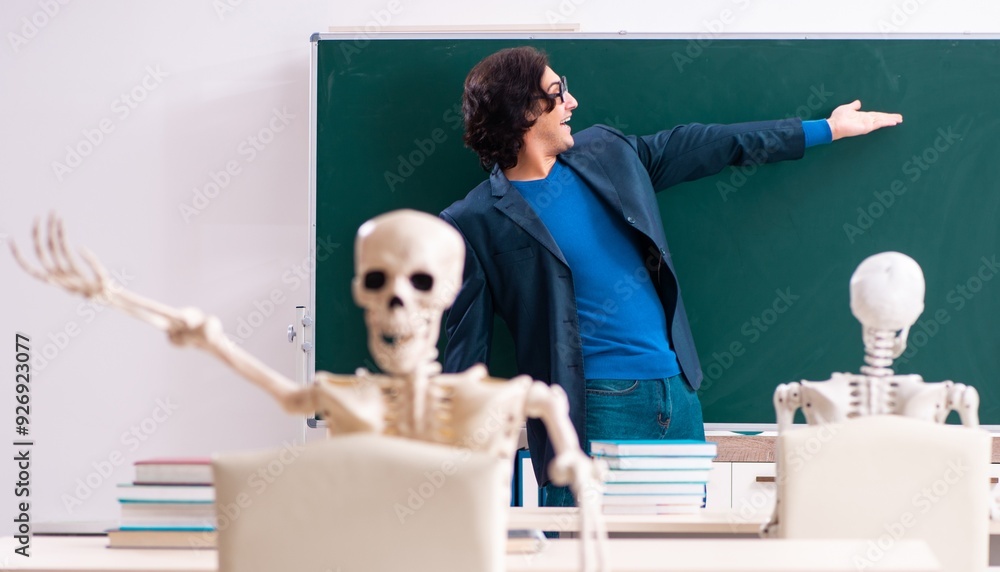 Wall mural male teacher and skeleton student in the classroom