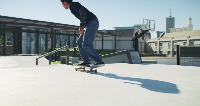 Man, skateboard and jump with grind, rail and speed with balance, training and exercise in park. Person, skating outdoor and urban playground with workout, ollie and ramp for extreme sports in city