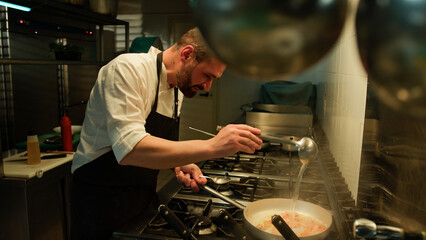 Chef Measuring Water Inside The Pan