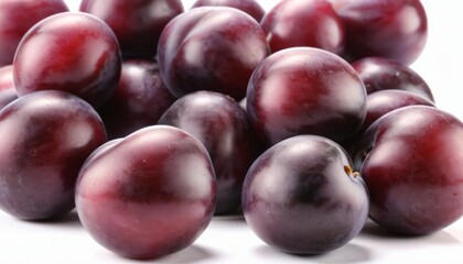 Fototapeta premium Vibrant purple plums in a closeup shot