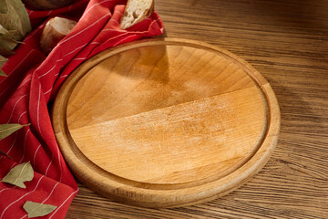 Wooden Cutting Board with Bread and Ingredients on Rustic Wooden Table