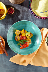 Grilled Vegetables on a Blue Plate with Rustic Table Setting