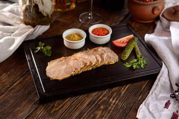 Roasted Pork with Mustard and Adjika on Rustic Cutting Board