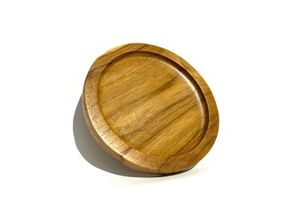 Round solid natural wooden saucer serving tray, serving platter for tea, coffee, food and home decoration. isolated on white background