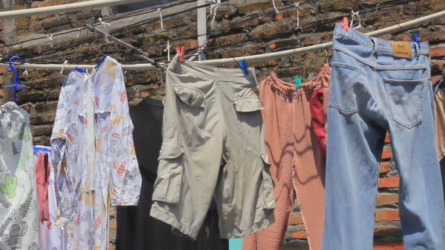 wet clothes drying under the morning sun