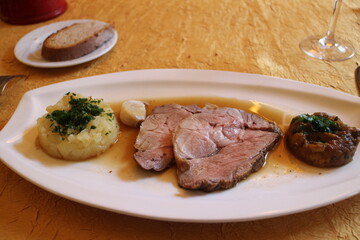 French cuisine: roast pork in Saint-Cirq-Lapopie, France