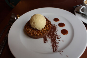 French dessert: chocolate tart with ice cream in Paris, France