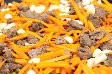 Carrots, meat and garlic, cooking street food