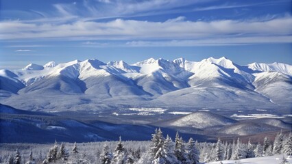 A breathtaking view of snow-covered mountains under a clear blue sky, symbolizing peace, tranquility, serenity, adventure, and nature's beauty.