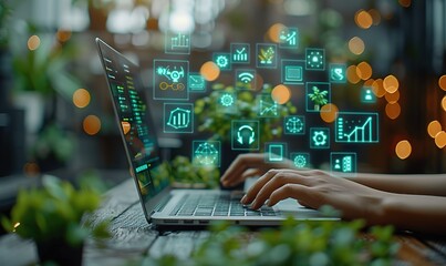 A person is typing on a laptop with a green screen that has many icons