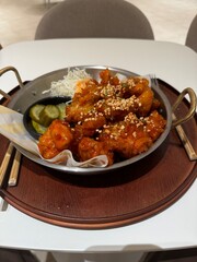 Busan, South Korea - 12 Aug 2024: Chilly Chicken with Pickles in club d oasis spa water park