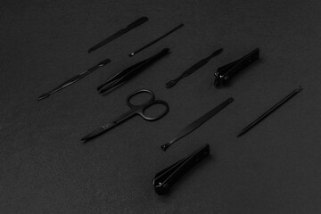 Black-Manicure-Set-Tools-on-Black-Background - Nail-Clippers - Scissors - Tweezers - Grooming-Kit