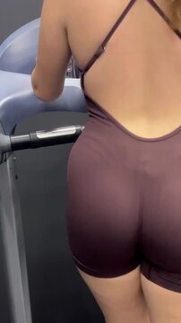 Woman training on walking treadmill at home or in gym, training, lose weight, cardio exercising, fitness, yoga, pilates video. 