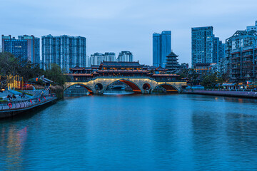 Fototapeta premium Famous landmark of Chengdu - Anshun bridge over Jin River illuminated at night, Chengdue, Sichuan , China