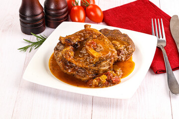 Italian cuisine - ossobuco with sauce