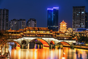 Famous landmark of Chengdu - Anshun bridge over Jin River illuminated at night, Chengdue, Sichuan , China