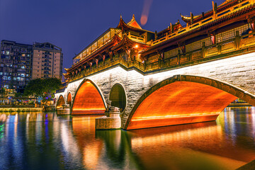 Famous landmark of Chengdu - Anshun bridge over Jin River illuminated at night, Chengdue, Sichuan , China