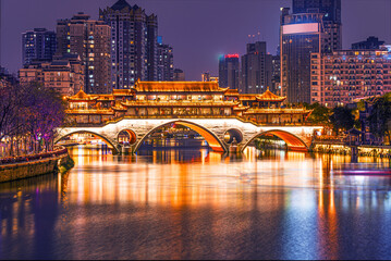 Famous landmark of Chengdu - Anshun bridge over Jin River illuminated at night, Chengdue, Sichuan ,...