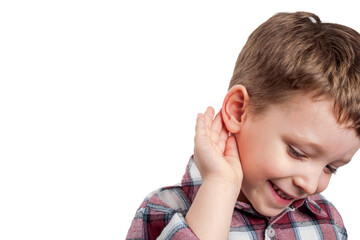 The boy, with his hand to his ear, listens attentively, conveying emotional sincerity and childish...