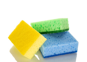 Three kitchen sponges, macro, isolated on white background.
