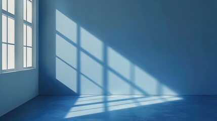 Fototapeta premium A single window is positioned on the wall of a blue room. Sunlight streams in through the window, casting long, rectangular shadows on the walls and floor. The room is empty, with only the light and s