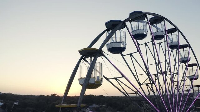 Sky, drone and ferris wheel for travel in city, lens flare and street view of amusement park for relax leisure. Cape town, sunset and urban in waterfront for mapping, tourist and destination vacation