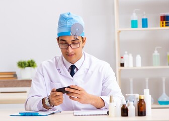 Young male doctor otolaryngologist working at the hospital