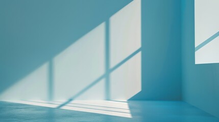 Fototapeta premium Sunlight shines through a window, casting rectangular shadows on a blue wall. The room has a blue floor and a corner visible in the image. The light patterns create a geometric design.