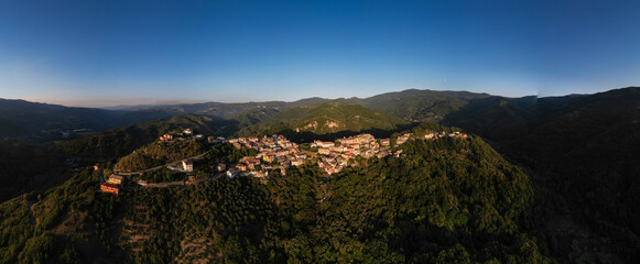 Panoramic aerial view with drone of Martirano in Calabria on sunset.