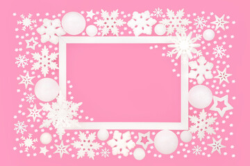 Fantasy Christmas enchanting snowflake star background border on pink, white frame. Seasonal festive design for Noel, Yule, Xmas greeting card, gift tag, label.