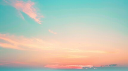 Naklejka premium A soft, pastel pink and blue sunset sky with delicate, wispy clouds stretching across the horizon. The colors are muted and dreamy, creating a sense of peace and tranquility.