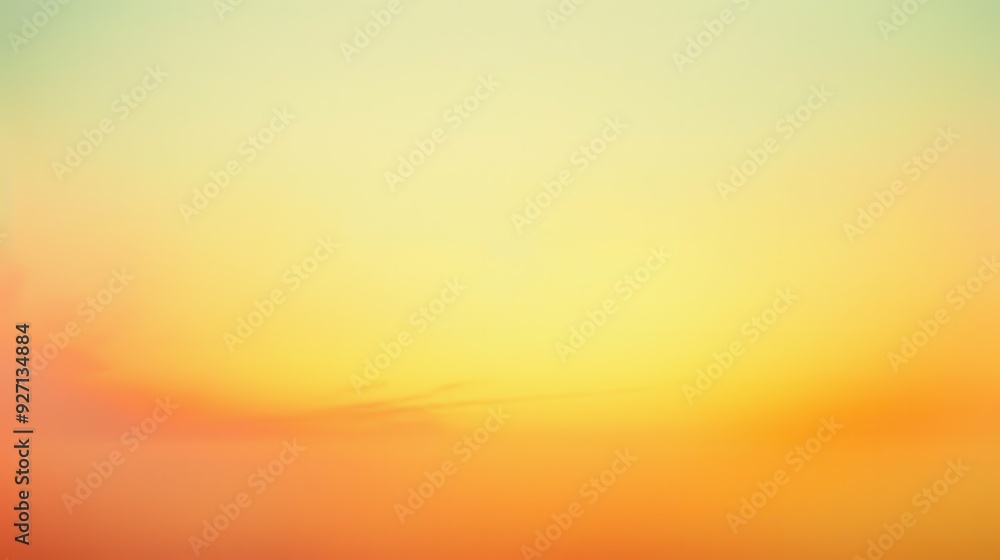Poster a blurred image of a sunset sky with shades of yellow, orange, and a hint of green. the image is sof