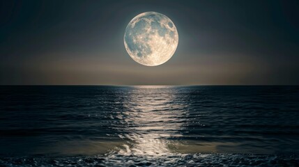 Fototapeta premium Full moon over the sea with sea wave on sandy beach.