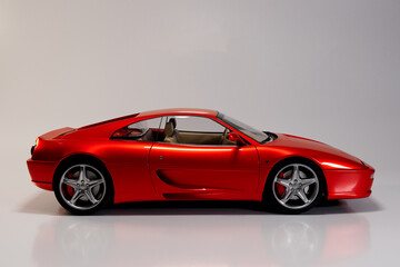 Naklejka premium Orange sport car on white background, high quality 3D image.