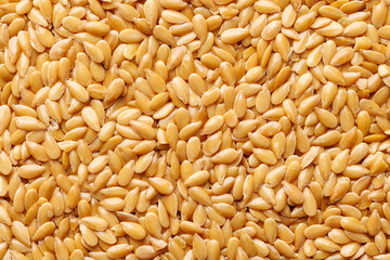 Gold flax seeds, macro. Flax seed background