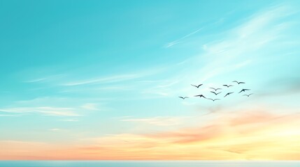 Fototapeta premium A serene sky at dusk, with soft pastel colors and a flock of birds gracefully flying. Perfect for tranquil nature imagery.