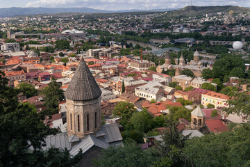 Obraz premium Panoramic cityscape of old town with buildings roofs traditional christian churches, Tbilisi, Georgia